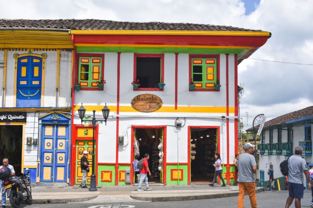 Vibrant colonial architecture on a bustling street in Salento, Colombia.