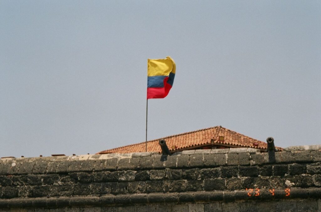 Colorful Colombian flag waving at a historic fort in sunny Cartagena, Colombia., Cartagena