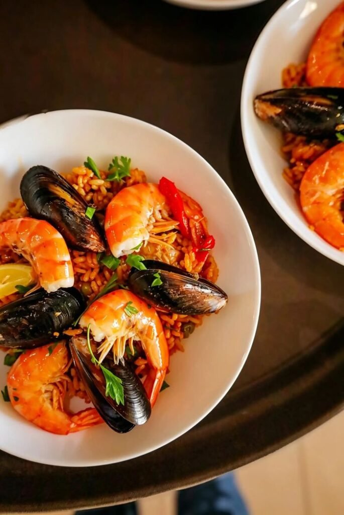 Close-up of vibrant seafood paella with shrimp and mussels, perfect for culinary delights., Cartagena