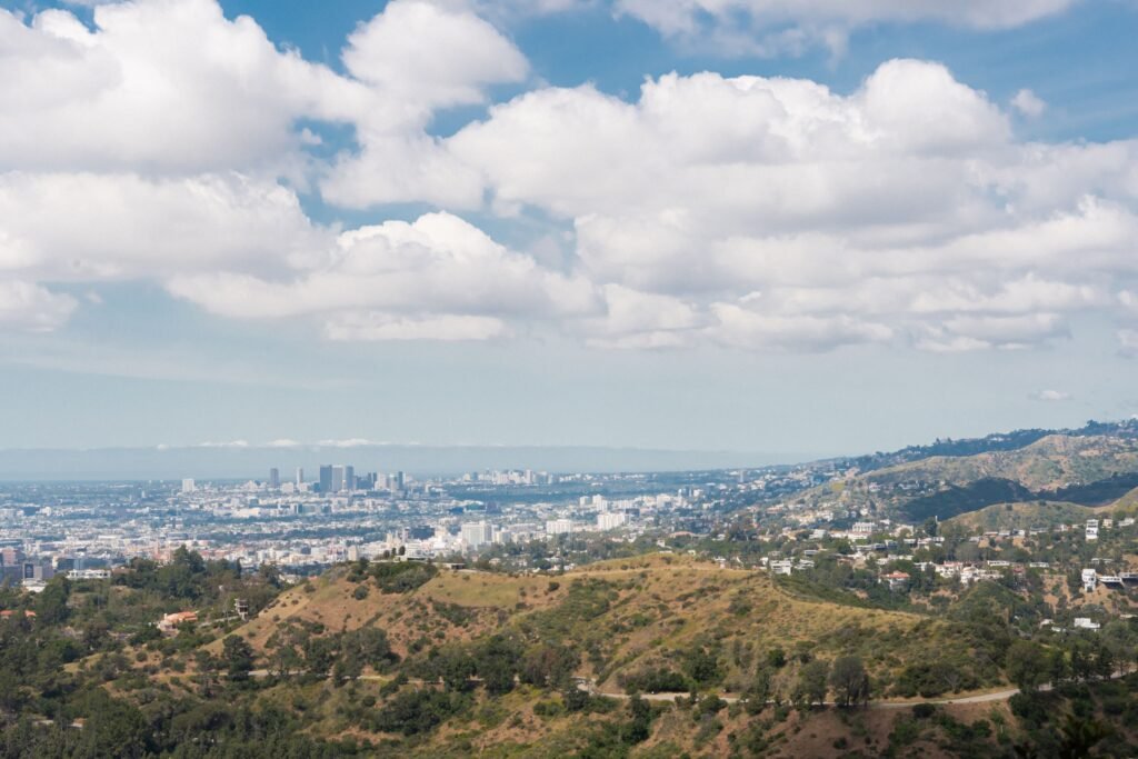 A sweeping view of Los Angeles cityscape from Griffith Park on a sunny day. Cali