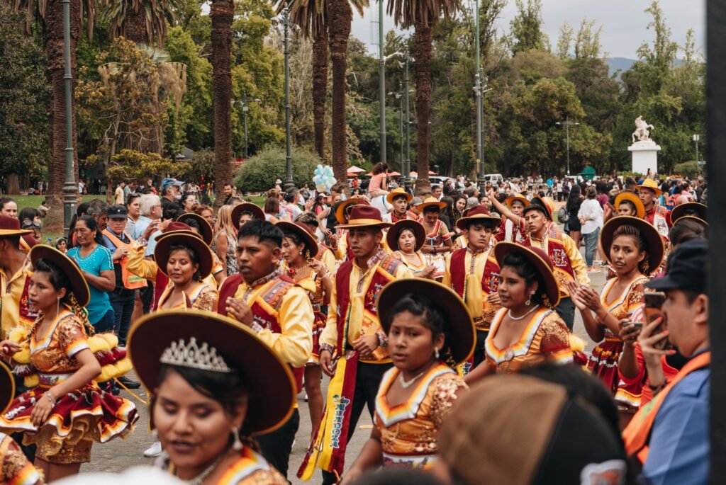 Colorful parade showcasing traditional clothing and dance in Mendoza, Argentina. Turismo cultural
